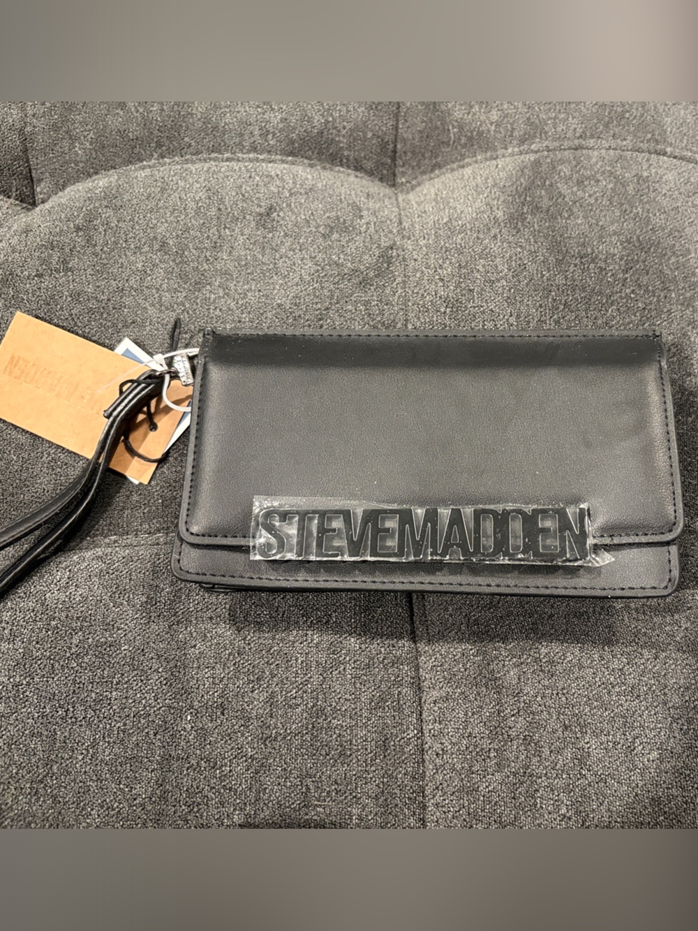 Steve Madden Black Leather Wristlet with Raised Logo Plaque